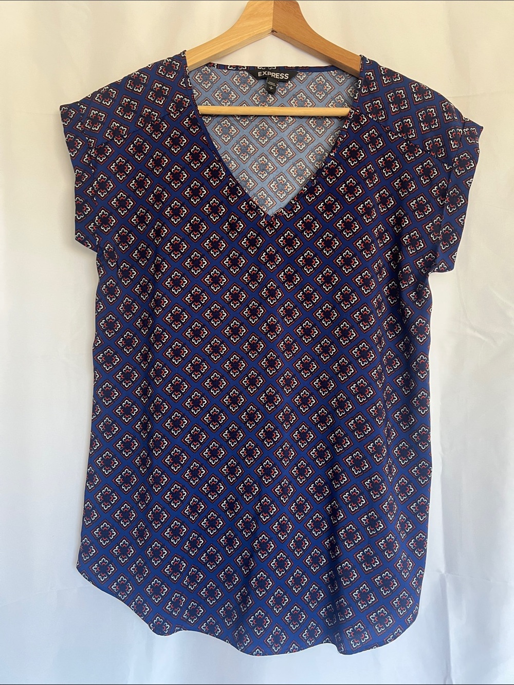 Express blue blouse with white and brown geometric pattern